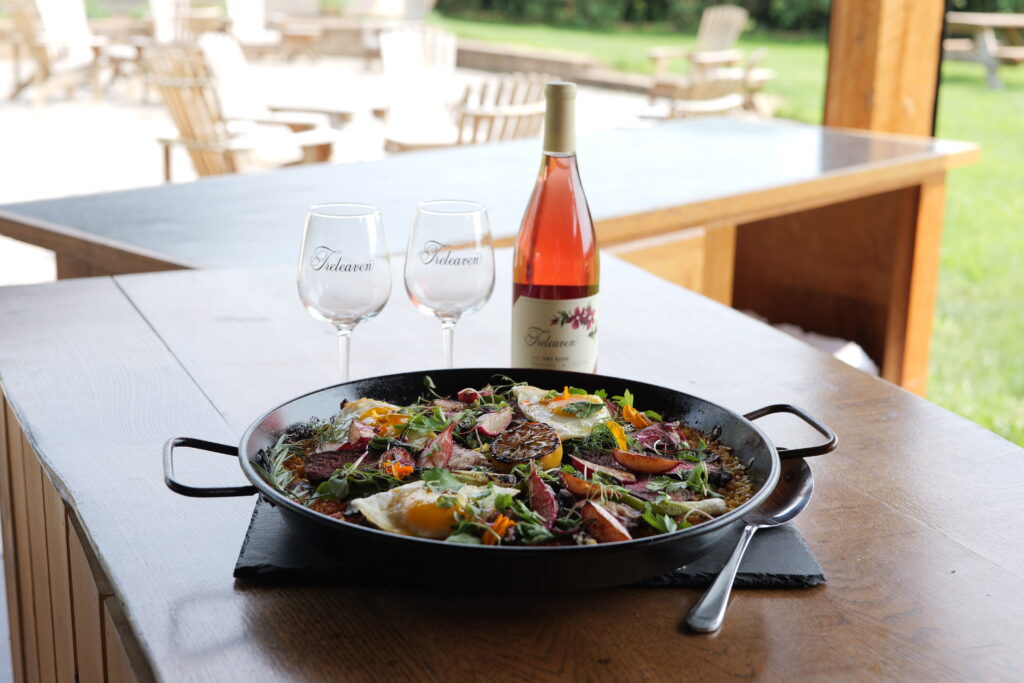 Paella with wine and glasses