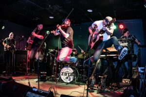 Simple black silhouette of a guitar